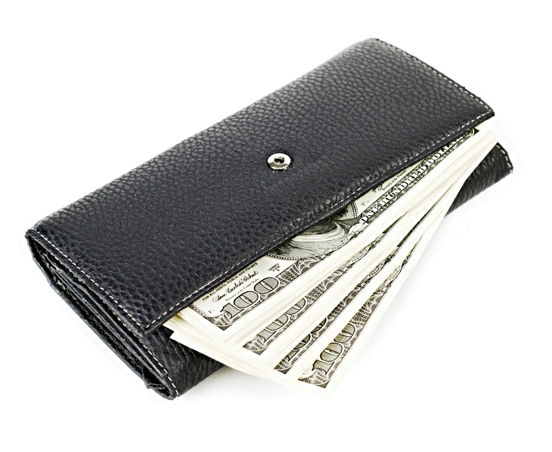 Hundred dollar bills in black leather wallet