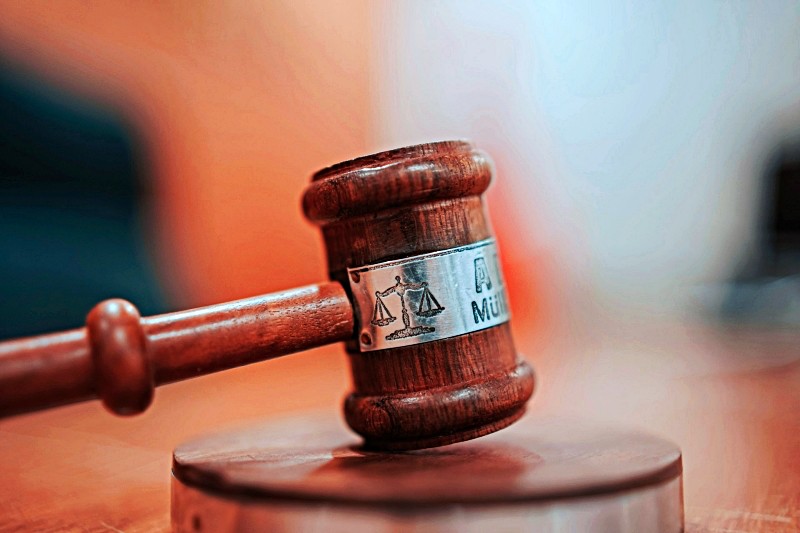 Wooden gavel on courthouse desk