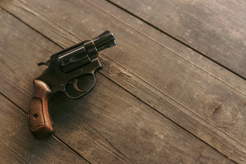 Revolver on wooden table