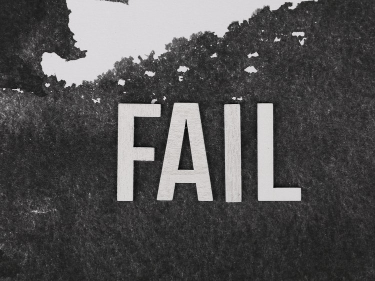 'FAIL' in all caps, white font against black and white background