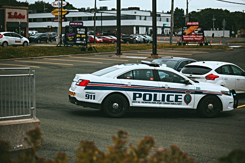 Police car in retail parking lot